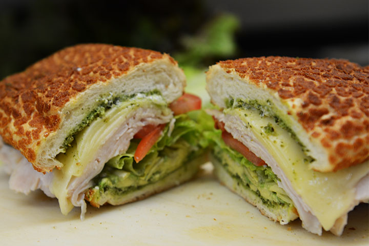 Delicious turkey or ham, avocado and tomato sandwich